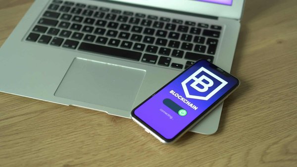 What are the steps to develop a blockchain-based voting system for elections?